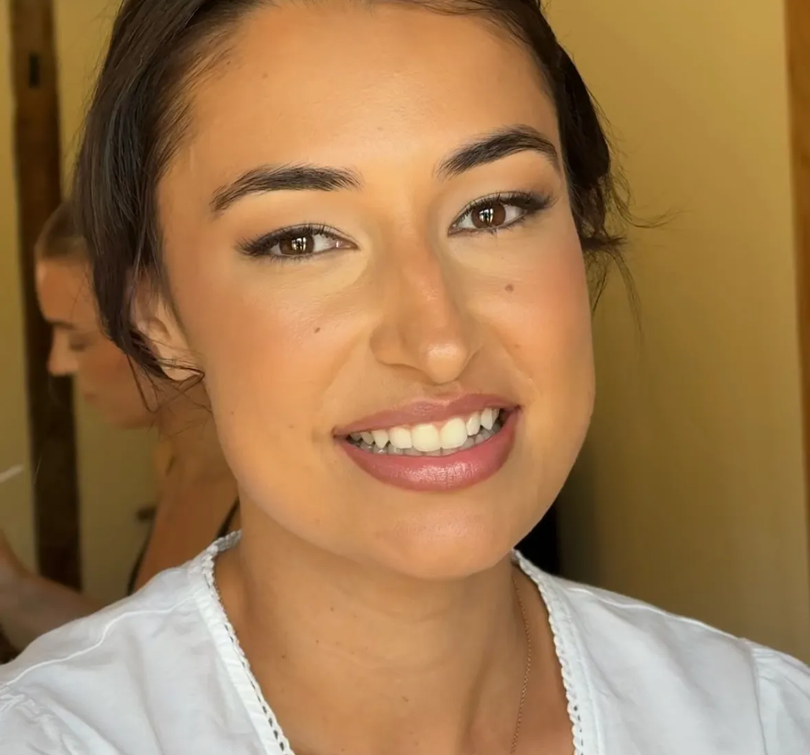 Bride smiling on her wedding morning at a Hertfordshire barn venue