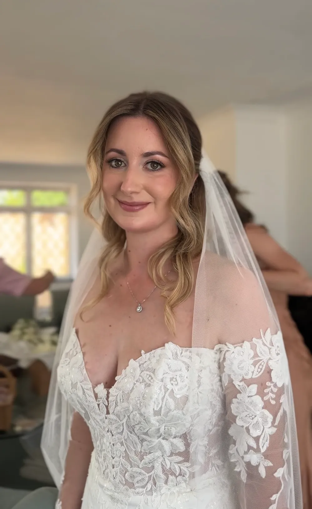 Bride in her veil with soft, natural bridal makeup
